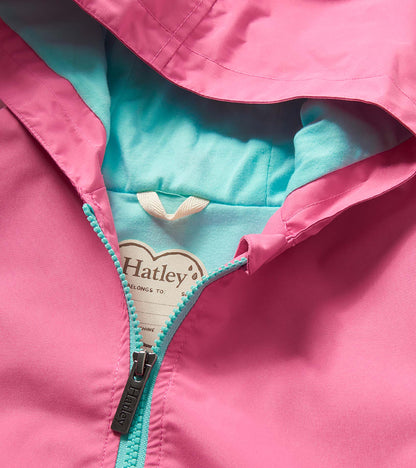 Pink girls rain jacket with turquoise lining and zipper, shown in close-up front view.