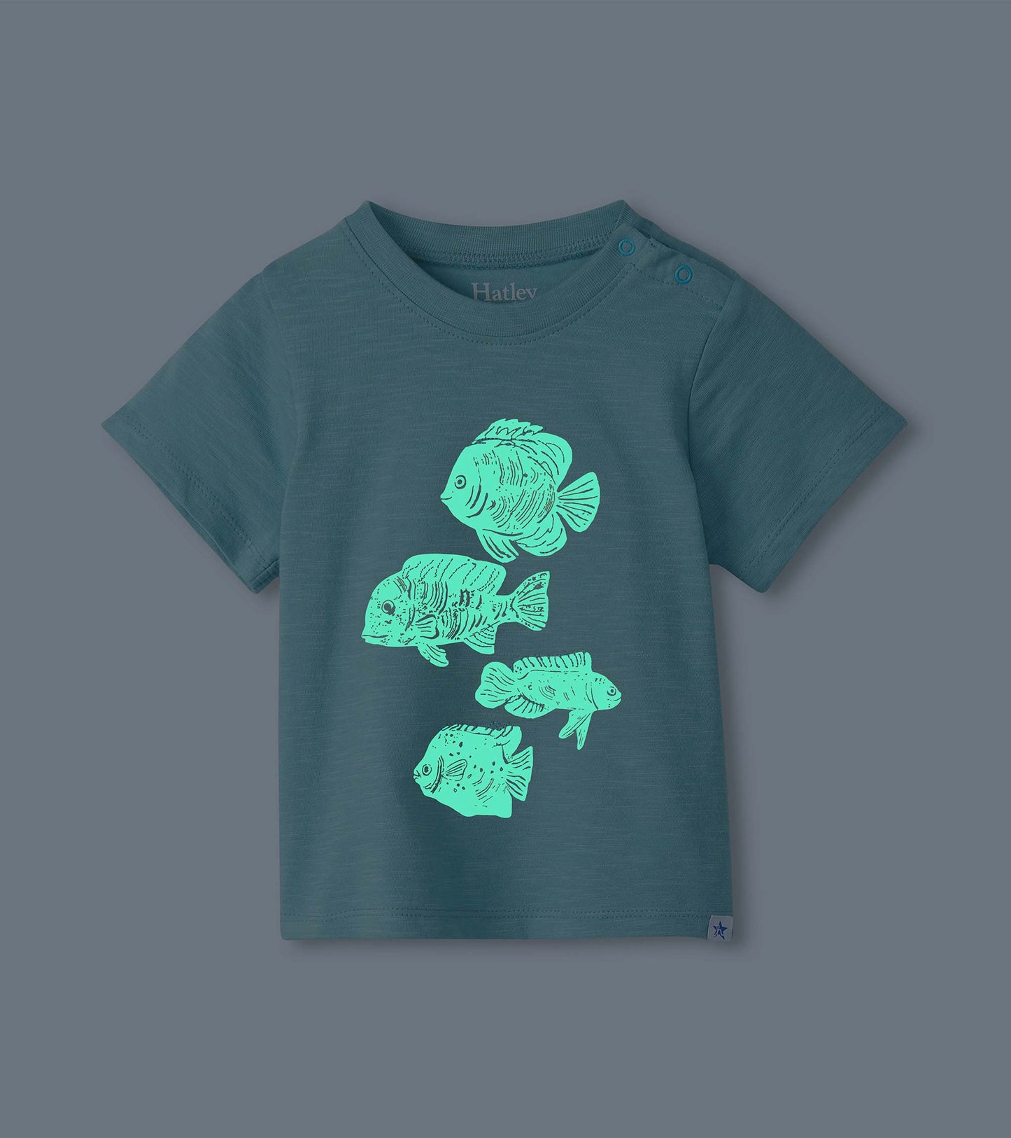 Dark teal toddler T-shirt with short sleeves and four glowing fish graphics on the front