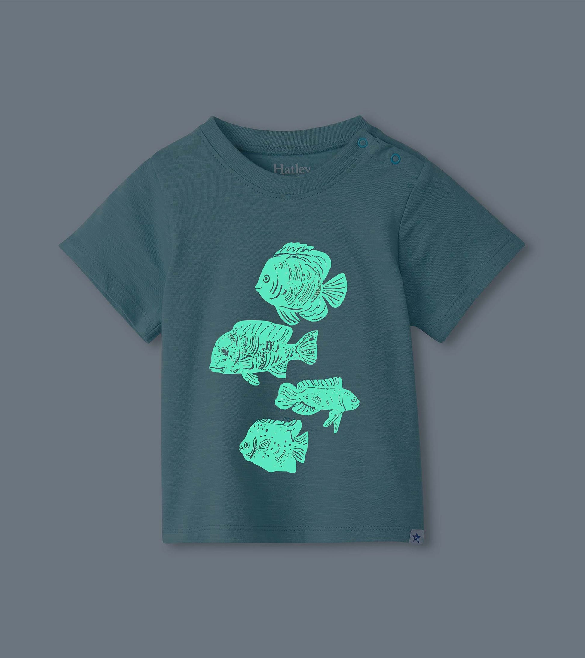 Dark teal toddler T-shirt with short sleeves and four glowing fish graphics on the front
