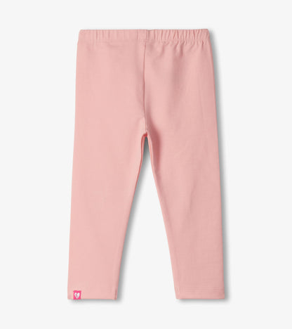 Pink toddler leggings with elastic waistband and small butterfly logo at the hem, front view