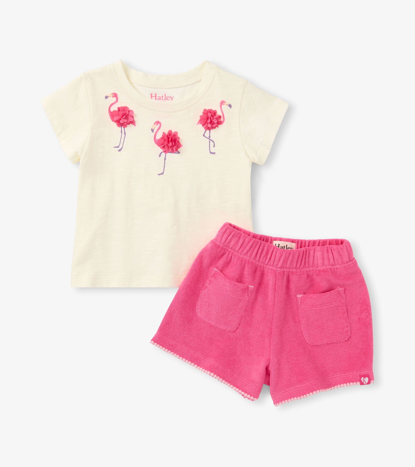 Cream short-sleeve T-shirt with pink flamingo print and bright pink shorts set, front view