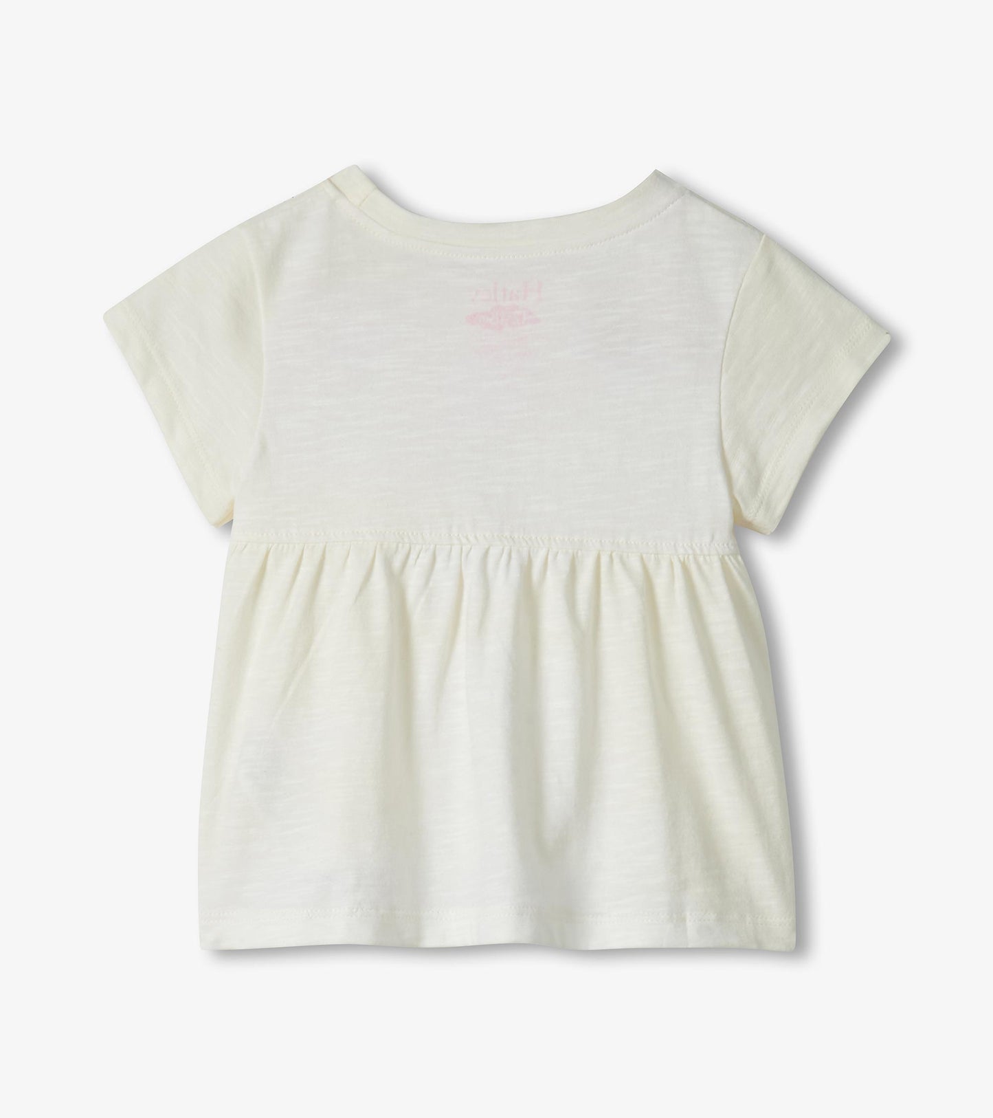Cream short-sleeve toddler dress with gathered waist and faint pink flamingo print on back, back view