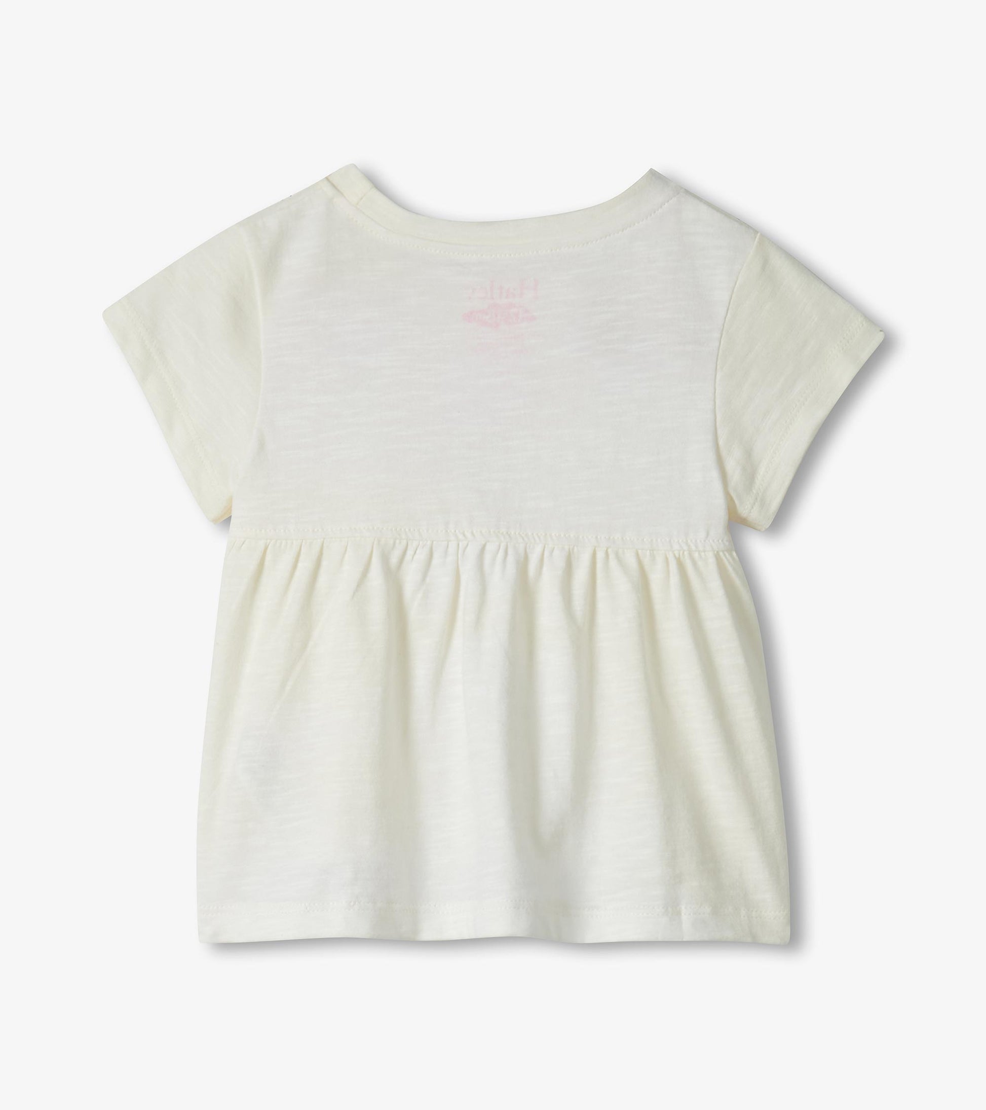 Cream short-sleeve toddler dress with gathered waist and faint pink flamingo print on back, back view