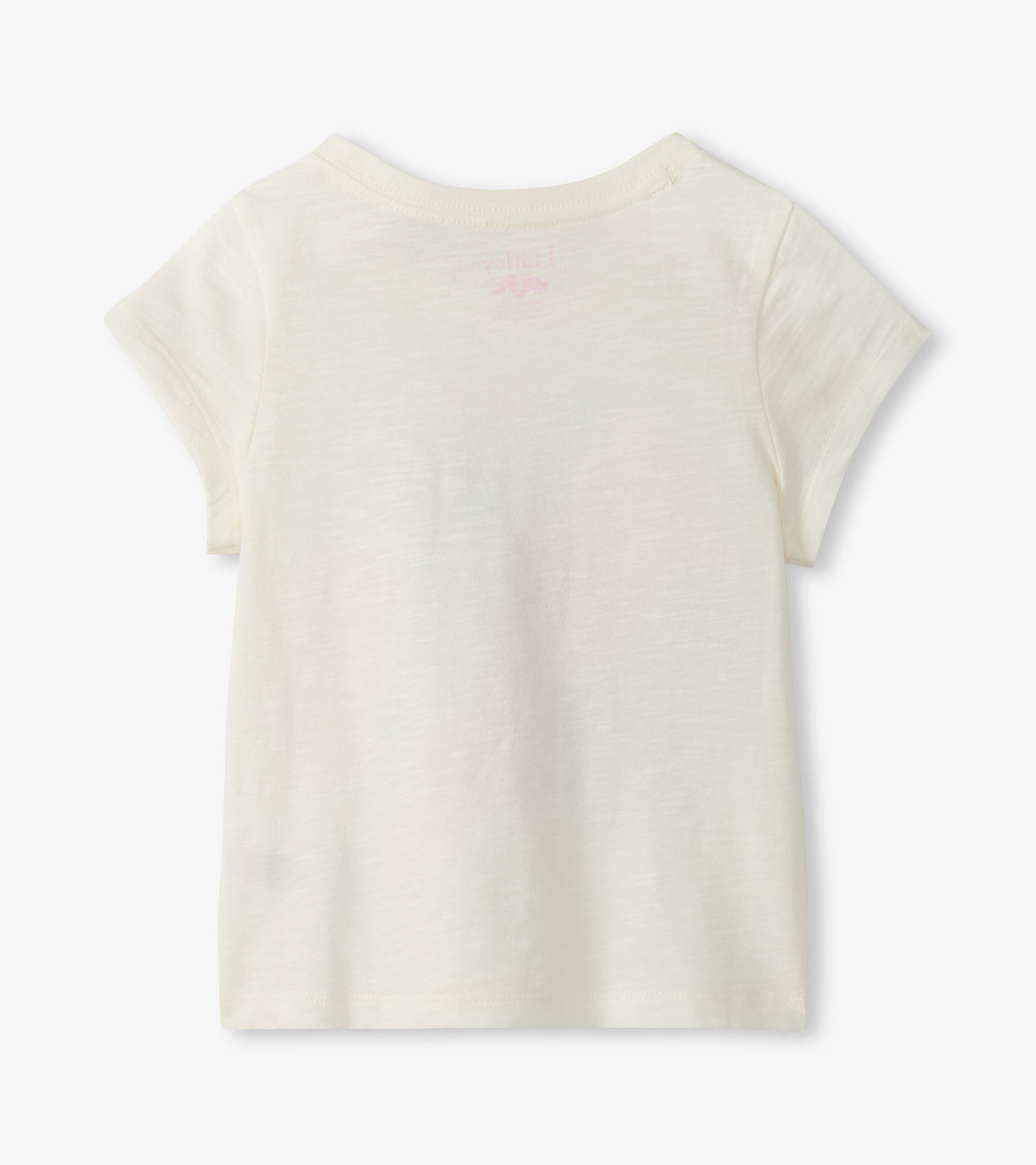 Cream short-sleeve girls T-shirt with small pink graphic on the back, shown flat lay back view
