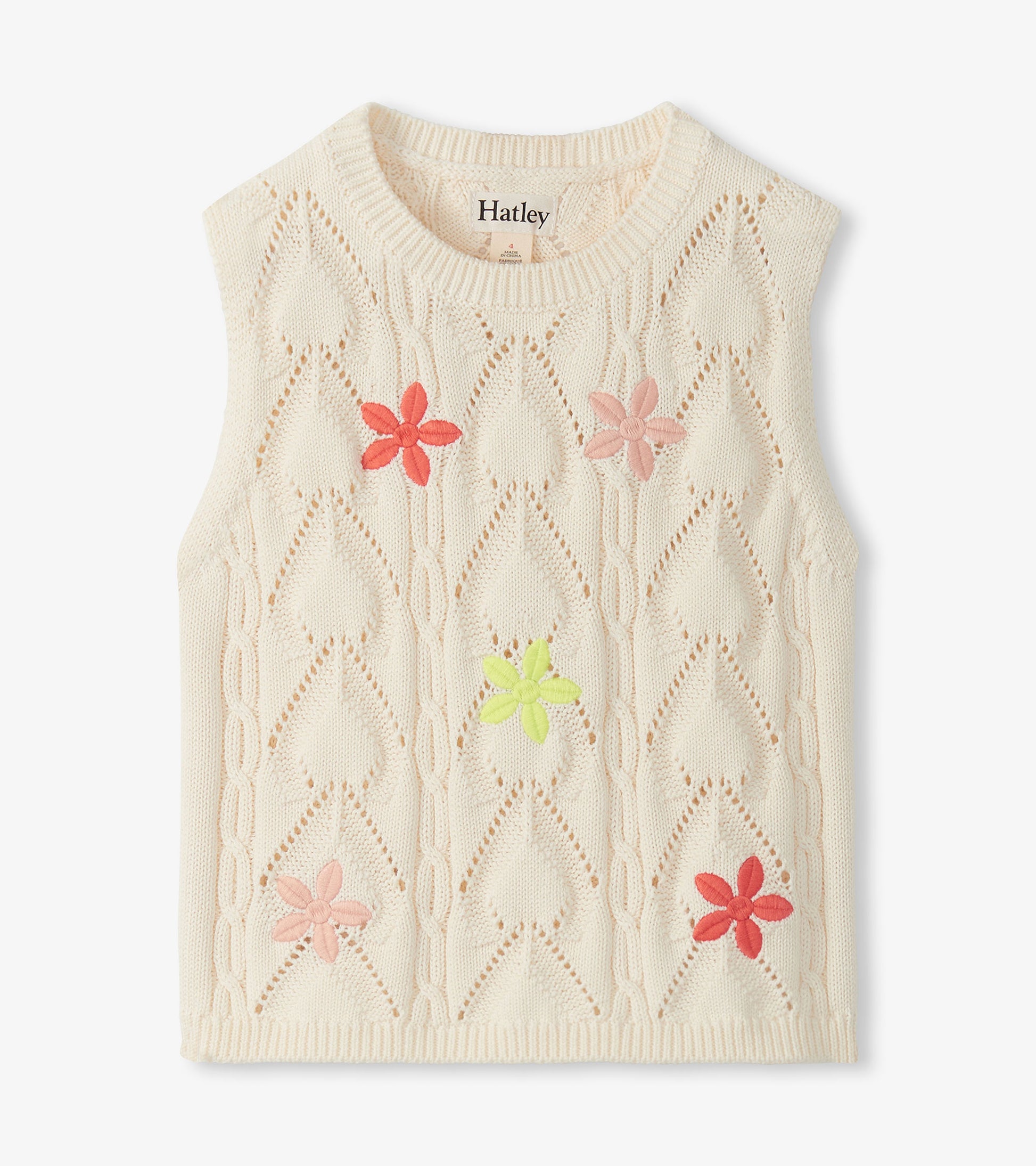 Cream sleeveless knit top with openwork diamond pattern and pink, coral, and lime flower appliqués