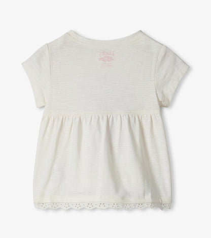 Cream short-sleeve toddler T-shirt with gathered hem and lace trim, back view