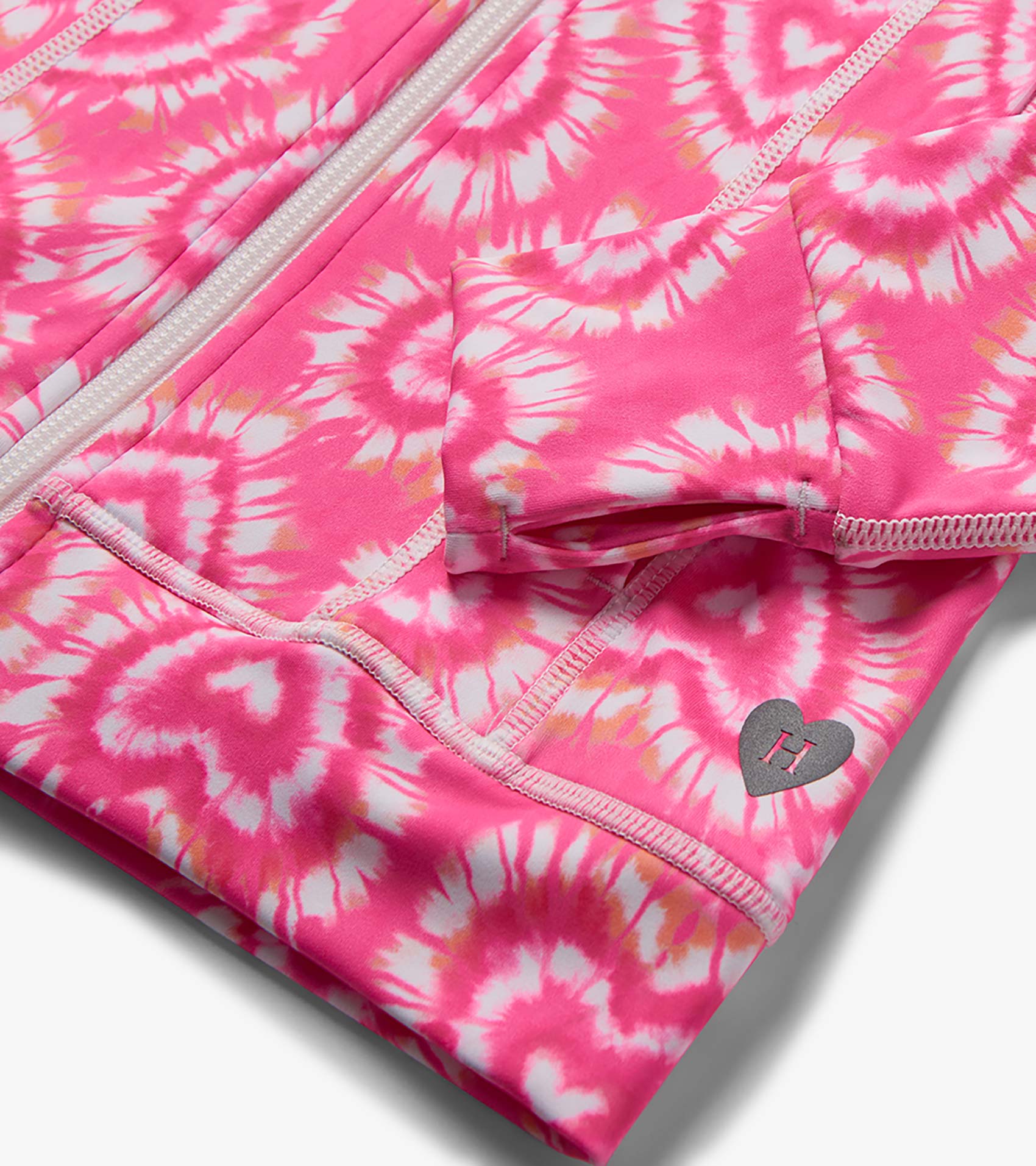 Pink and white tie-dye girls' active jacket with zipper, pocket, and heart logo detail