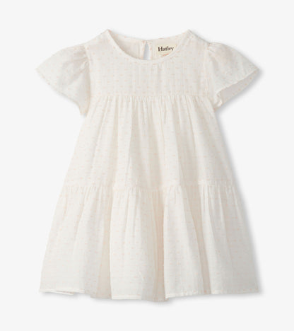 Pearl Swiss dot toddler dress with short puff sleeves, round neck, gathered waist, and tiered skirt
