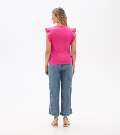 Back view of a bright pink sleeveless tank top with ruffled shoulder caps and a straight hem