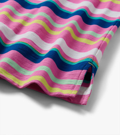 Close-up of a pink, blue, white, and green wavy striped knit dress hem with side slit