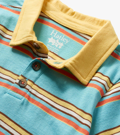 Close-up of a turquoise striped toddler polo shirt with yellow collar and button placket