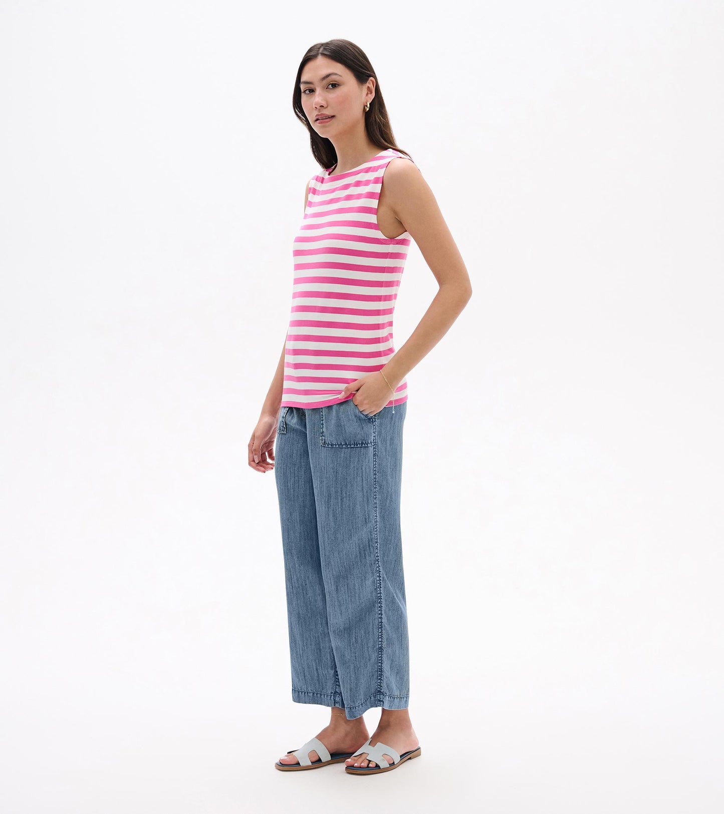 Sleeveless pink and white striped tank top, front view on model