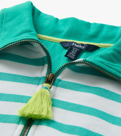 Close-up of a green and white striped mock neck pullover with front zipper and tassel pull.