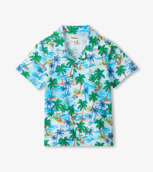 Short-sleeve button-down shirt with light blue tropical palm tree print, front view