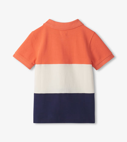 Back view of a boys' short-sleeve polo shirt with orange, white, and navy color blocks