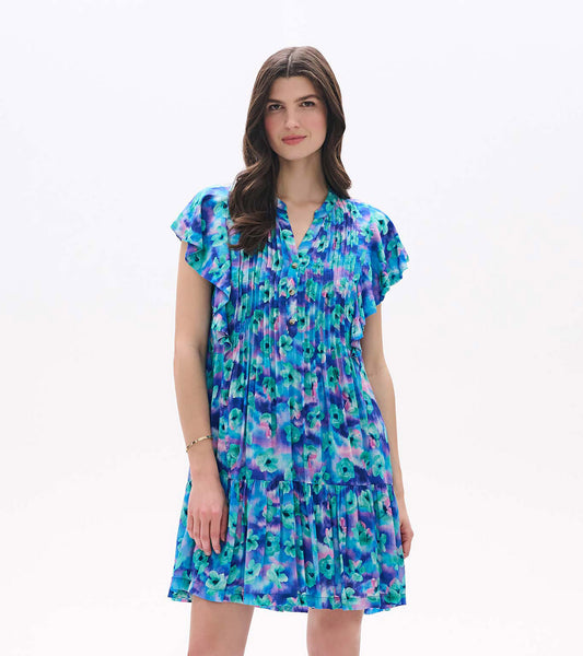 Front view of Floating Flowers pintuck dress with blue and purple floral print, flutter sleeves, and tiered hem