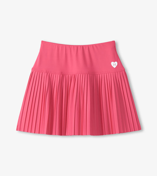 Pink girls sporty skort with pleated skirt and small heart logo on the front