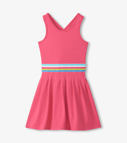 Front view of bright pink sleeveless active dress with pleated skirt and multicolor striped waistband