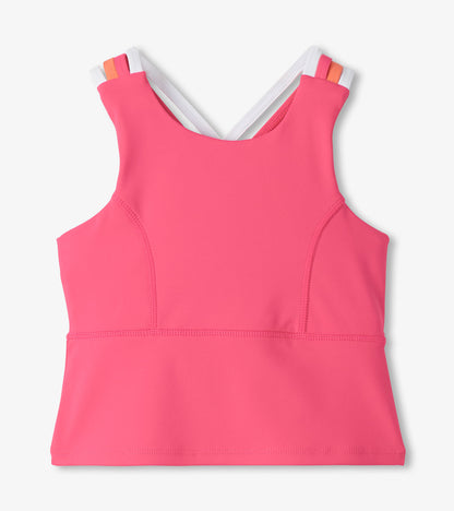 Pink girls' active tank top with strappy back and white, orange-trimmed straps, front view