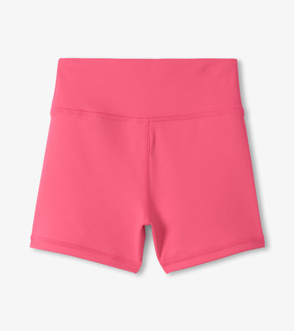 Pink girls active shorts with a high waistband, front view, made of smooth stretch fabric.