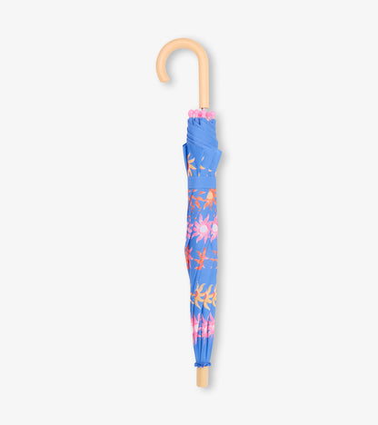 Folded blue umbrella with pink and orange floral print and tan curved handle