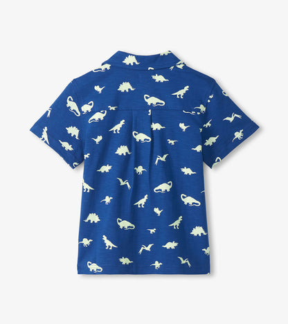 Blue short-sleeve button-down shirt with white dinosaur print, back view
