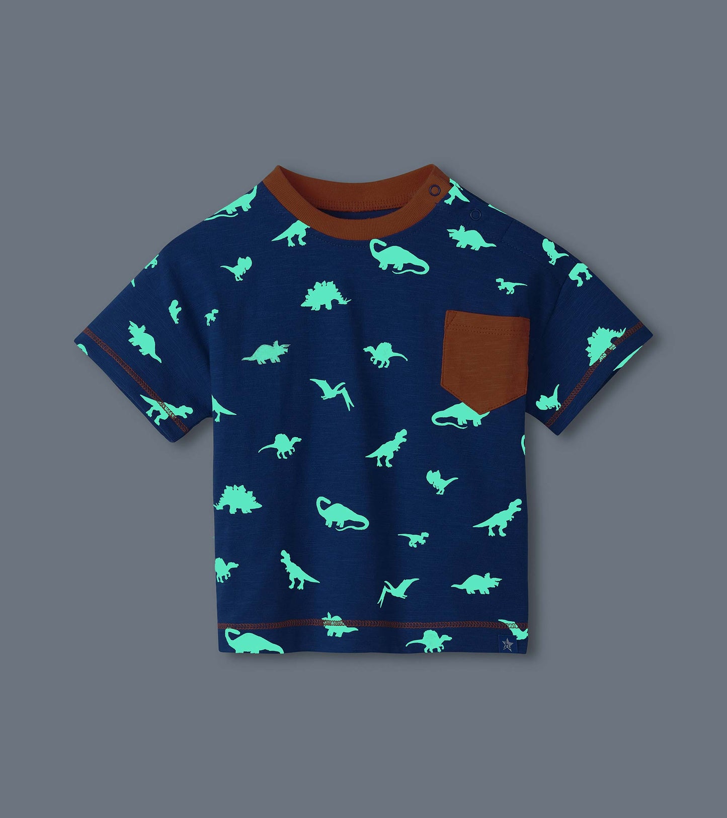 Navy short-sleeve toddler T-shirt with glowing dinosaur print, brown ribbed collar, chest pocket, and crew neck