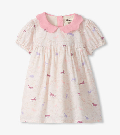 Girls cream dress with pink collar and puff sleeves, featuring a pastel pony print and gathered waist, front view