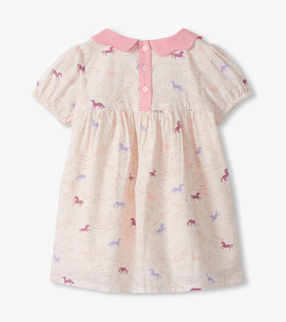 Pink and cream short-sleeve toddler dress with pony print, scalloped collar, and button front