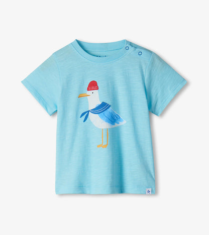 Light blue short-sleeve toddler T-shirt with seagull graphic and shoulder snaps, front view