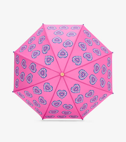 Pink umbrella with blue-and-white heart pattern, open front view