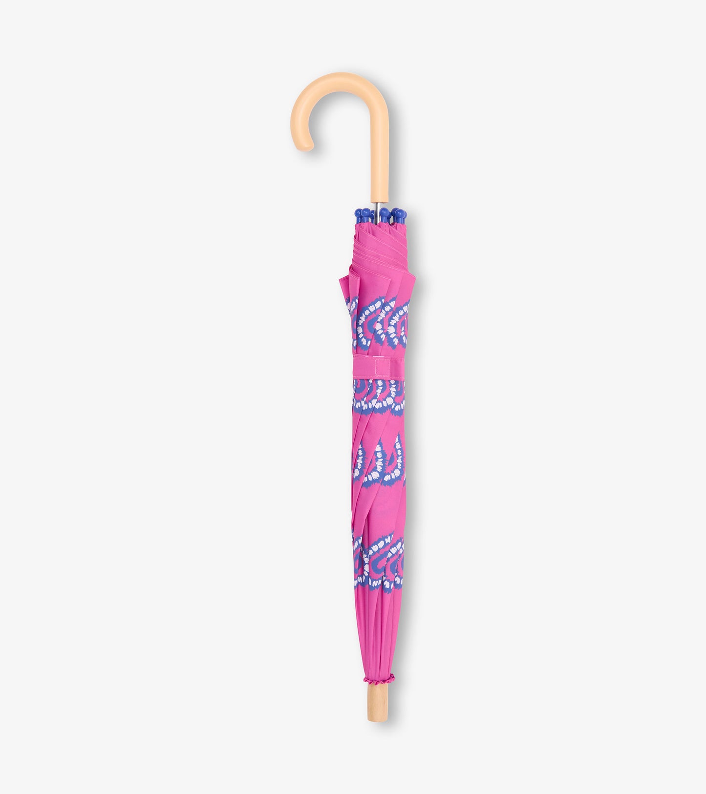 Folded pink kids umbrella with blue heart burst pattern and tan curved handle