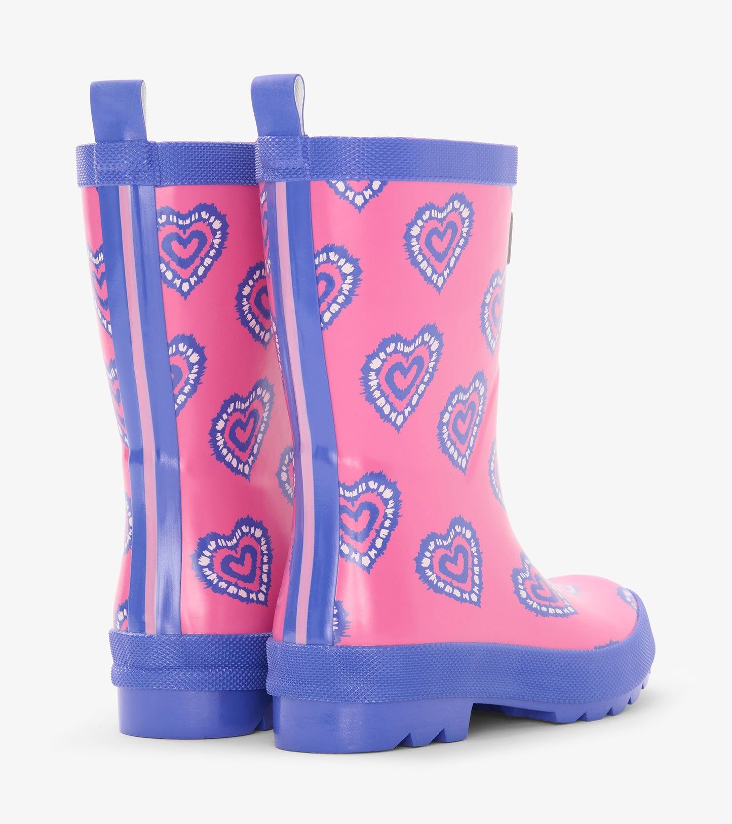 Pink kids rain boots with blue heart pattern and blue trim, shown from the back/side view.