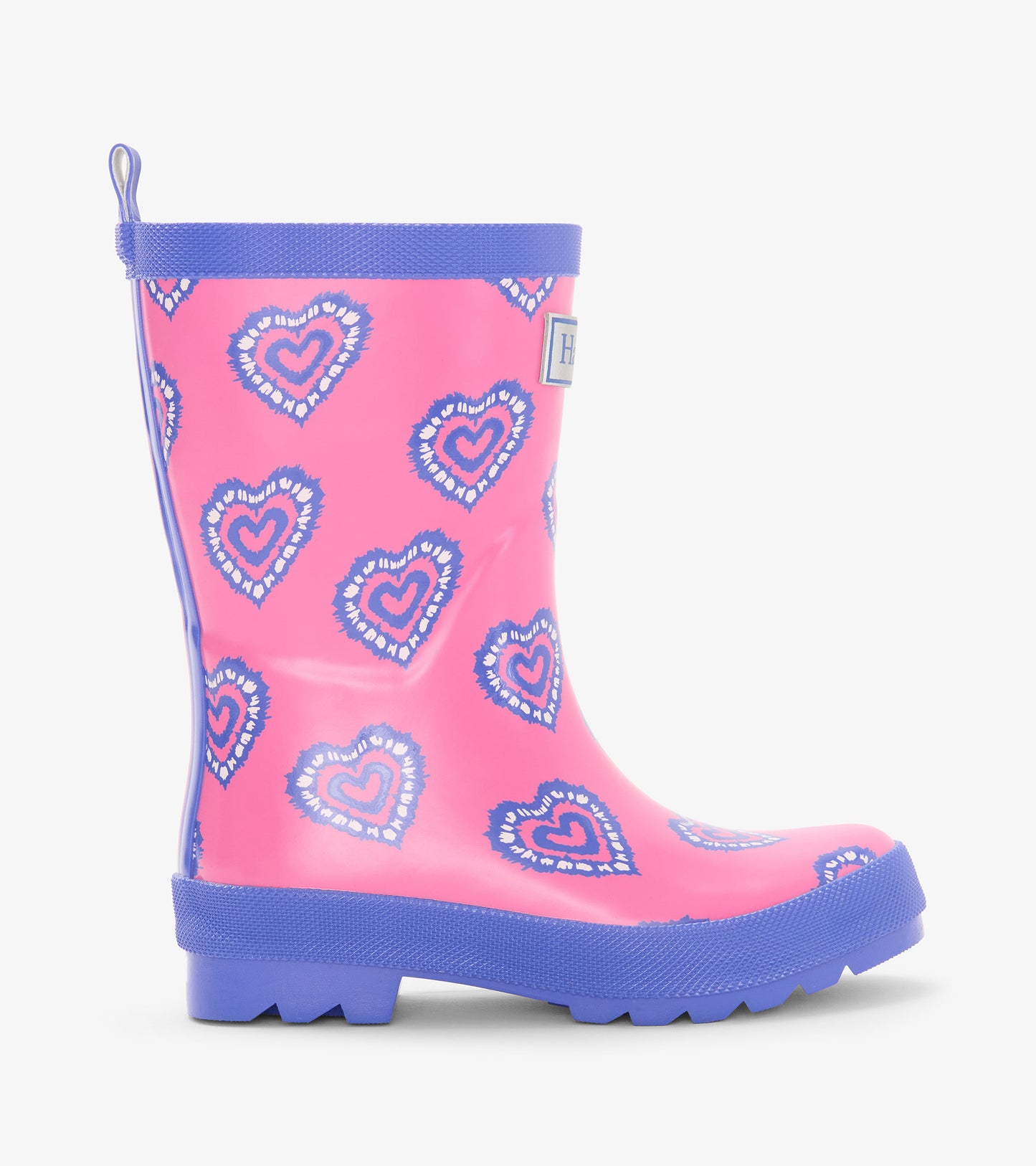 Pink kids rain boot with blue heart print, blue trim, and pull tab, side view
