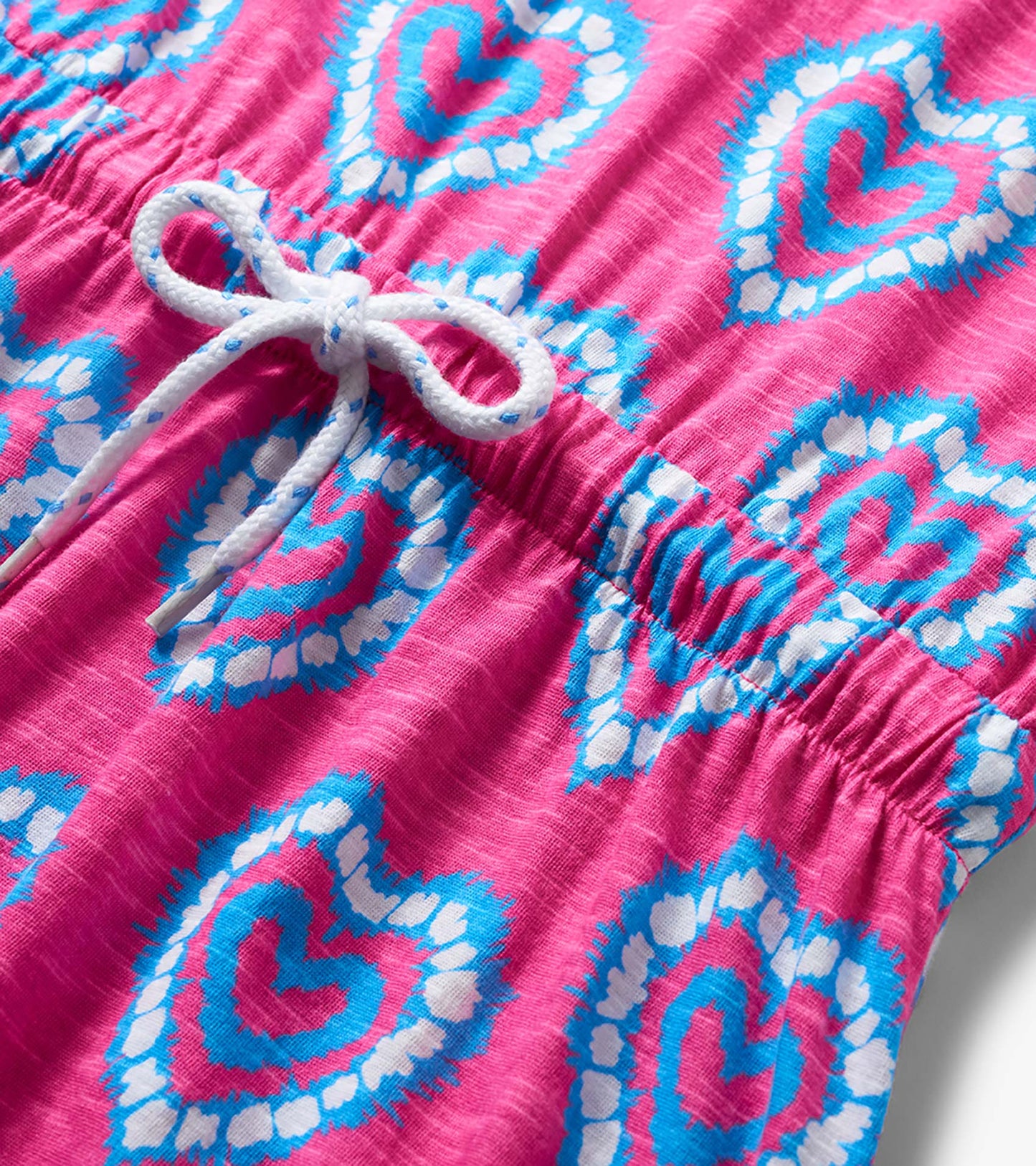 Pink girls dress with blue and white heart print and white drawstring waist detail