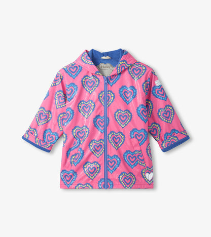 Pink hooded zip-up rain jacket with blue heart print and blue trim, front view
