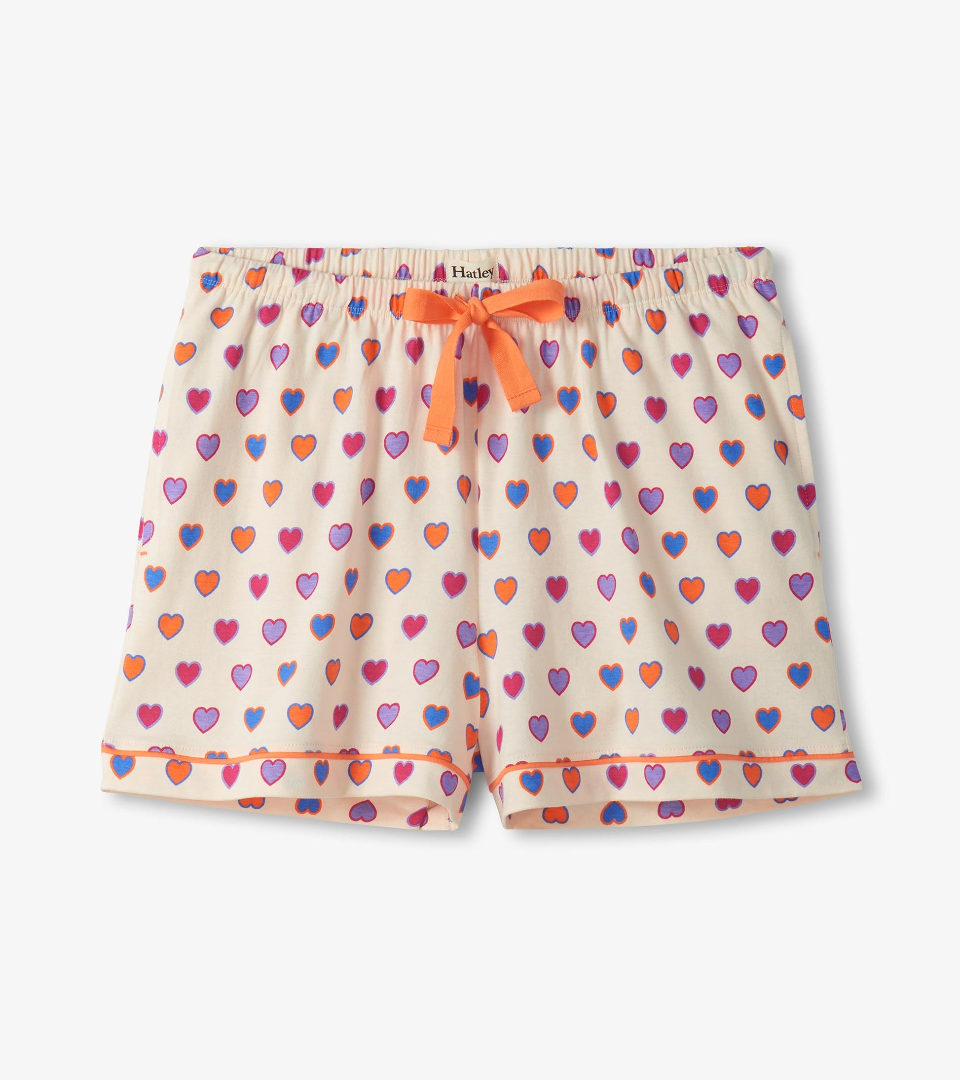 Cream pajama shorts with multicolor heart print and orange drawstring waistband, front view