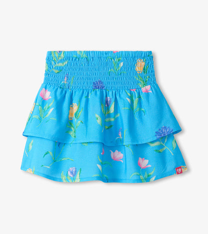 Blue girls skirt with smocked waist and layered floral print hem