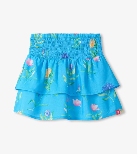 Blue girls skirt with smocked waist and layered floral print hem