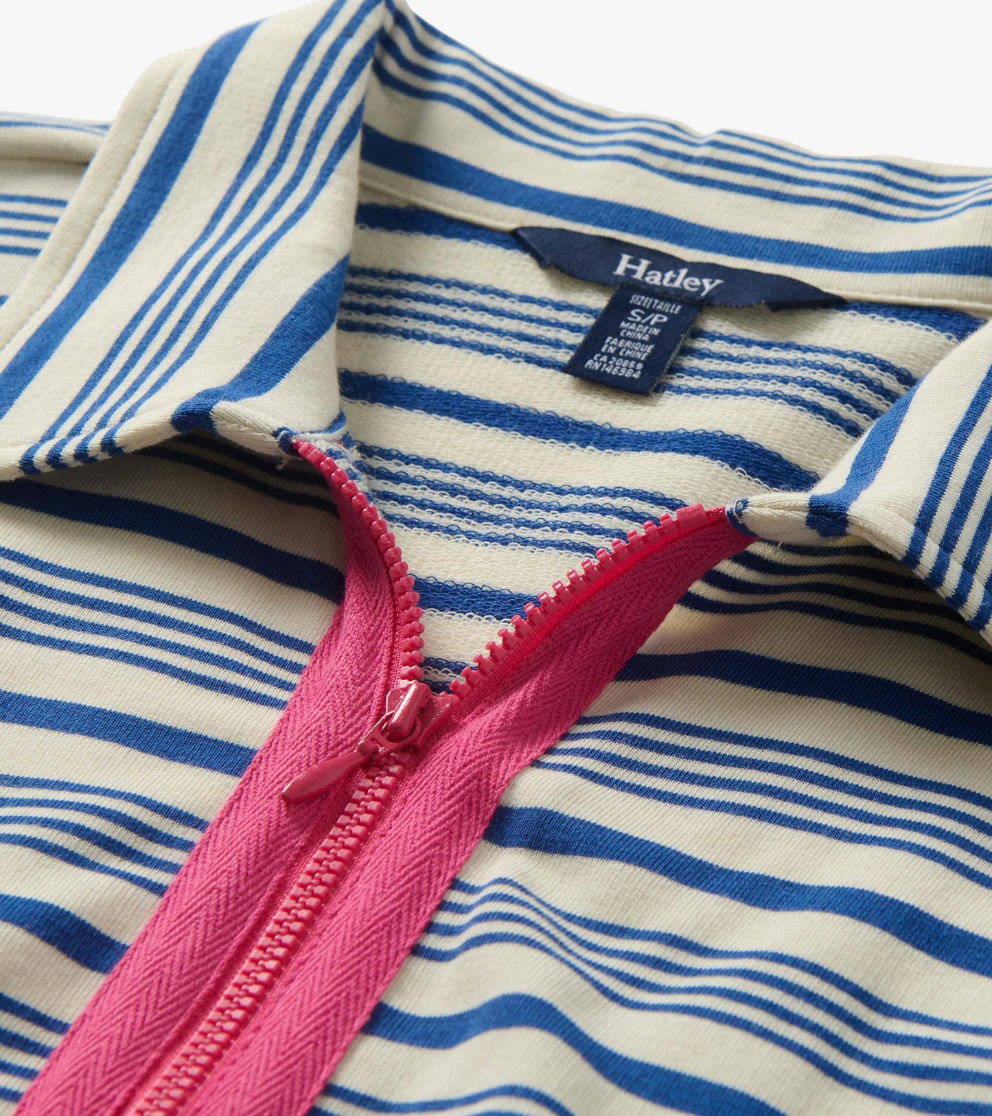 Close-up of cream and blue striped maxi dress with pink zip front and collar detail
