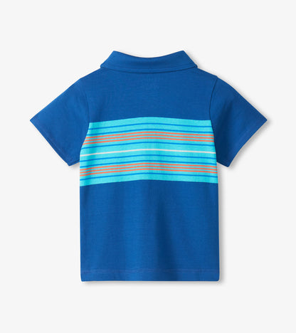 Back view of a blue short-sleeve polo shirt with turquoise and orange horizontal stripes across the upper back
