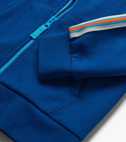 Blue boys' full-zip hoodie with turquoise zipper and striped sleeve detail, close-up view
