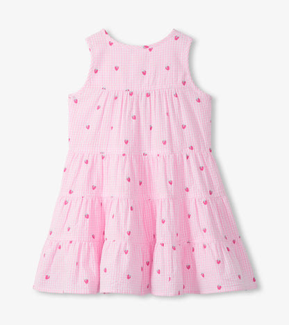 Back view of girls pink gingham tiered dress with tiny berry print and sleeveless bodice