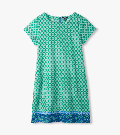 Flat lay of green medallion print tee dress with short sleeves and blue border hem