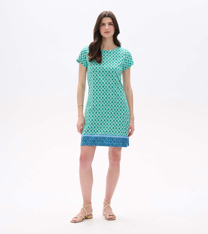 Front view of Arcadia Medallion tee dress in green and white print with short sleeves and blue border hem