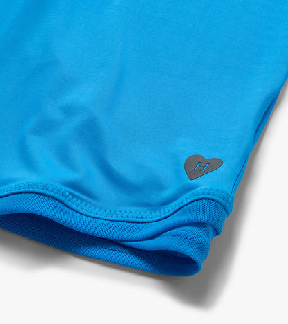 Bright blue girls T-shirt with mesh trim and small heart logo near the hem
