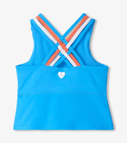 Girls blue strappy active tank with crisscross back straps and small heart logo on front