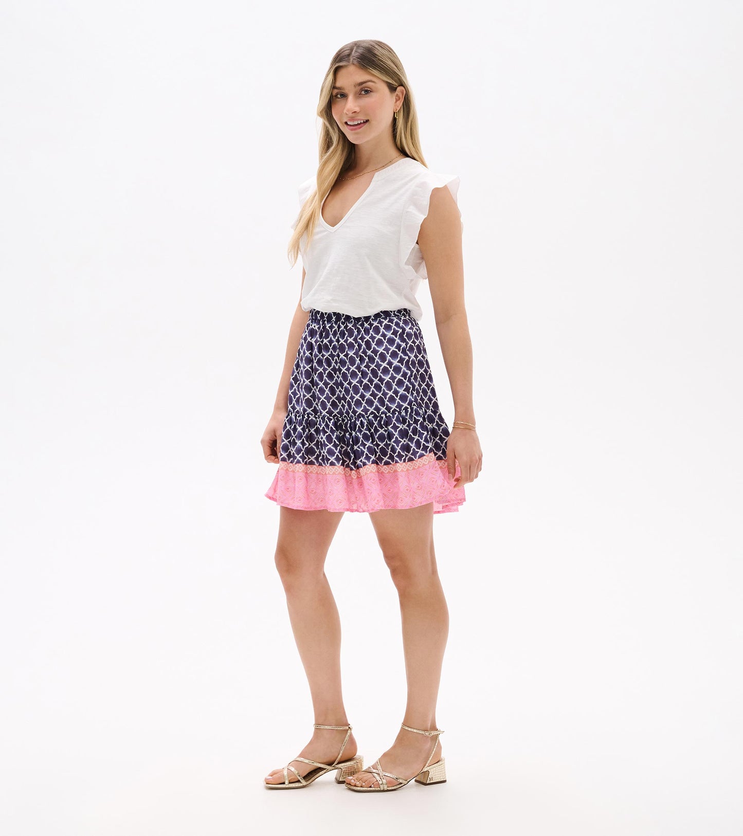 Navy and white patterned flounce skirt with pink ruffle hem, shown on model front view