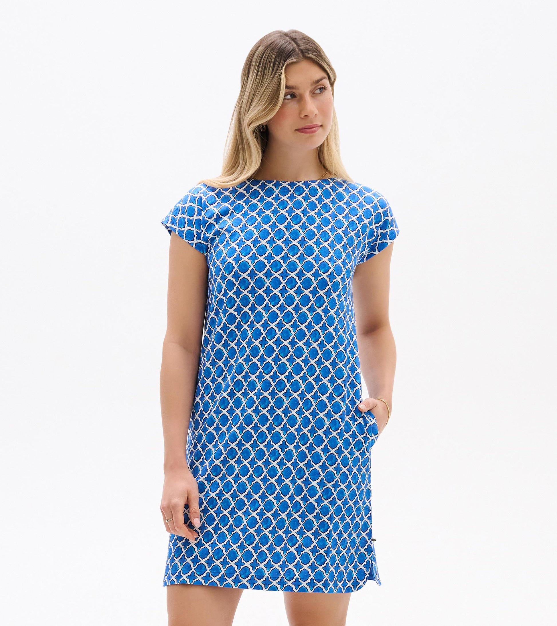 Blue and white medallion print short-sleeve shift dress, front view, with boat neckline and side pockets