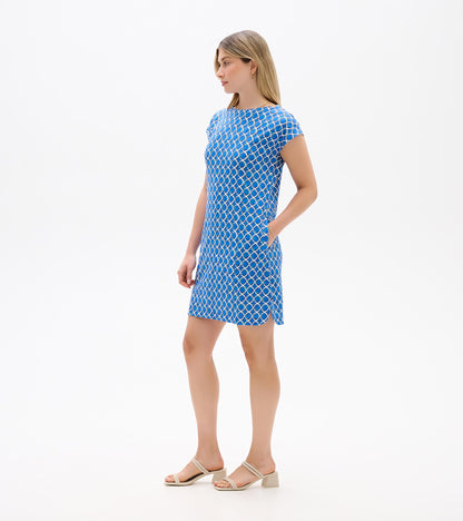 Blue and white geometric print short-sleeve shift dress with side pockets, shown on a model in side view.